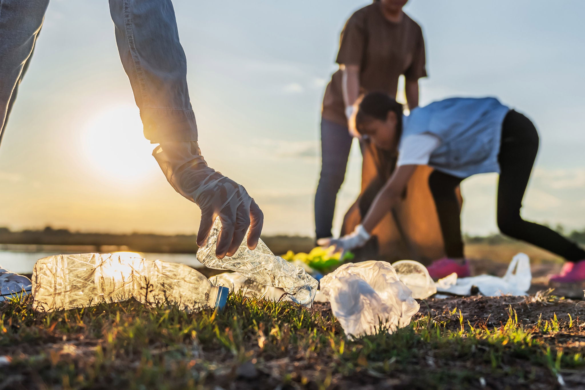  People picking up thrown out plastics